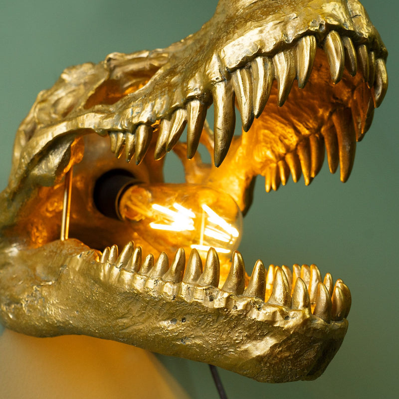 Offenes Maul des Sauriers Rexy mit leuchtender Glühbirne
