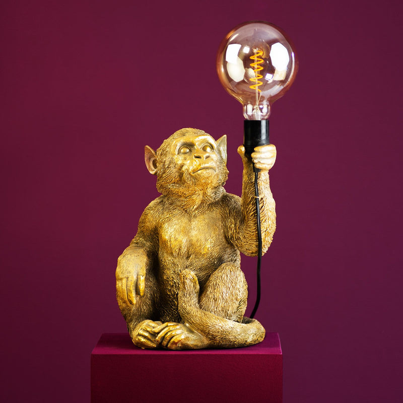 Tischleuchte Affe Abu sitzend in Gold von Werner Voß